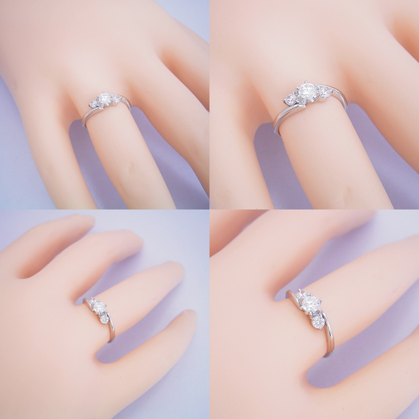 ティファニーセッティングの６本爪をベースに左右に大きなメレダイヤを留めた、６本爪サイドメレデザインの婚約指輪